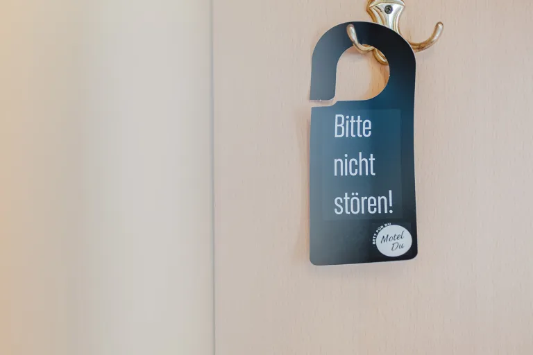 "Please do not disturb!" door hanger at Motel Baden