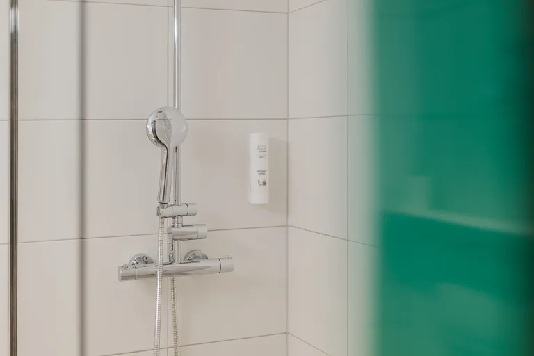 Shower fittings in the bathroom at Motel Baden
