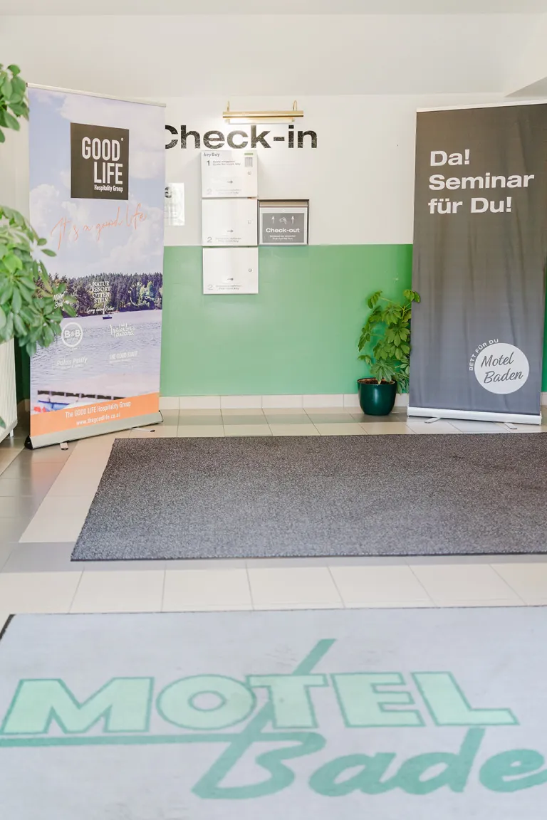 Entrance area with logo doormat at Motel Baden