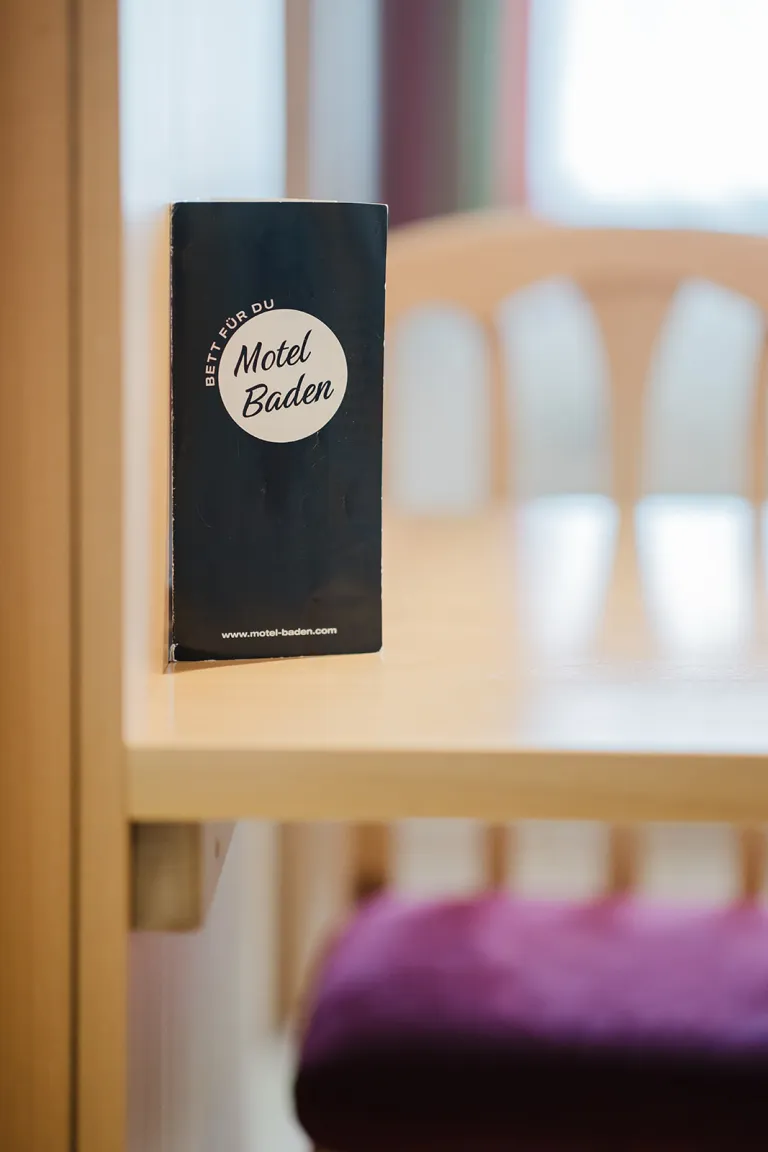Motel Baden flyer on the table in the room