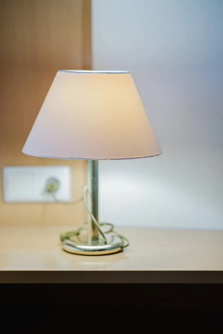 Bedside lamp in a room at Motel Baden