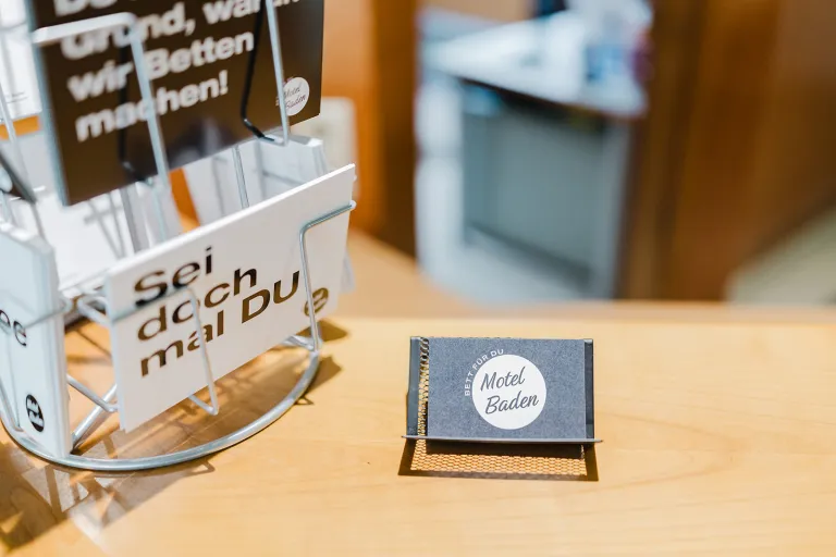 Brochures and business card at the reception of Motel Baden