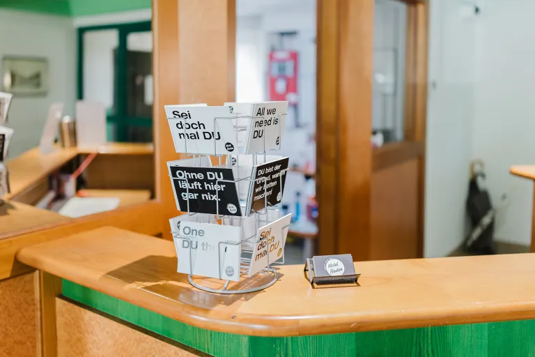 Reception with brochure stand at Motel Baden