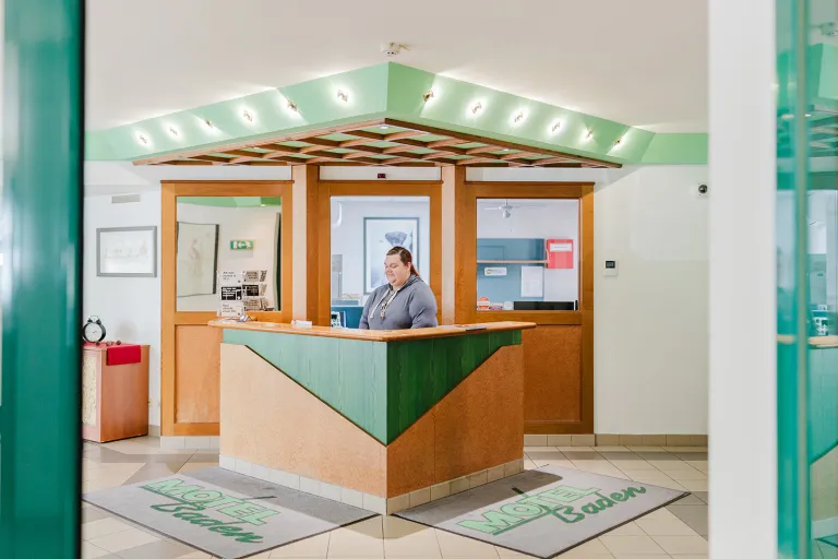 Reception of Motel Baden with staff member
