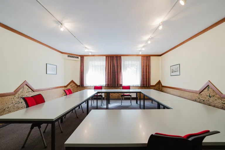 Small seminar room on the ground floor with tables in U-shape at Motel Baden