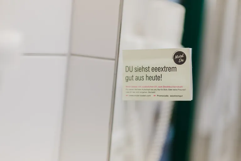 Card "YOU look simply great today!" in the bathroom at Motel Baden